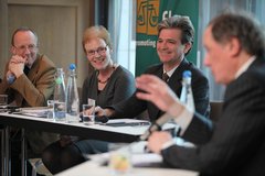 Professor Gerry Whyte, Noeline Blackwell, Director of FLAC and Mark O'Brien, Director of Probono.net react at a panel session hosted by Broadcaster Vincent Browne.